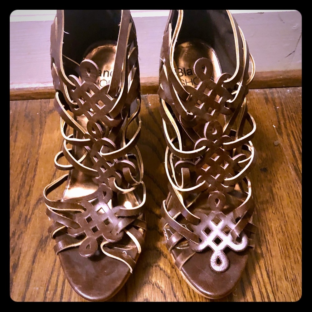Size 8 heels with detailed leather like design
